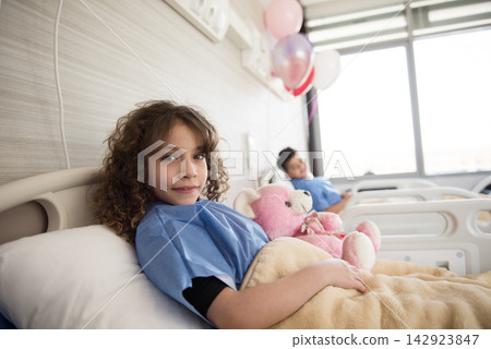 Modern Middle Eastern eye hospital pediatric patients resting in ward with teddy bears and balloons in Egypt Modern Middle Eastern eye hospital pediatric patients resting in ward with teddy bears and balloons in Egypt 142923847