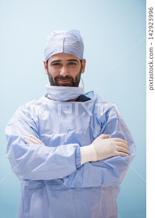 Confident Middle Eastern eye surgeon in scrubs at modern Egyptian hospital preparing for surgery 142923996