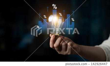 Business Growth Concept with Light Bulb and Graphical Elements Symbolizing Innovation, Ideas, and Market Trends in a Modern Financial Environment Cyphers. Business Growth Concept with Light Bulb and Graphical Elements Symbolizing Innovation, Ideas, and Market Trends in a Modern Financial Environment Cyphers. 142926447