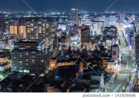 The city night view of the urban area and skyscrapers spreading around Takasaki Station. The city night view of the urban area and skyscrapers spreading around Takasaki Station. 142926686