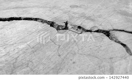 Monochrome Deep Crack in Concrete Surface Monochrome Deep Crack in Concrete Surface 142927440