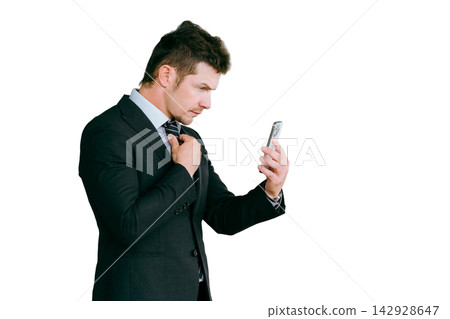 Foreign businessmen (trading company, trade, global, interpreter, translator) tidying up their appearance with their smartphone cameras. Foreign businessmen (trading company, trade, global, interpreter, translator) tidying up their appearance with their smartphone cameras. 142928647