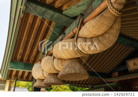 A giant sacred rope hung at the Kagura Hall of Izumo Taisha Shrine A giant sacred rope hung at the Kagura Hall of Izumo Taisha Shrine 142929721