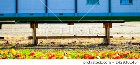 An empty bench on the school grounds in the countryside as autumn deepens. An empty bench on the school grounds in the countryside as autumn deepens. 142930146