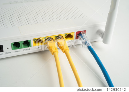 Ethernet cable with wireless router connect to internet service provider network. Ethernet cable with wireless router connect to internet service provider network. 142930242