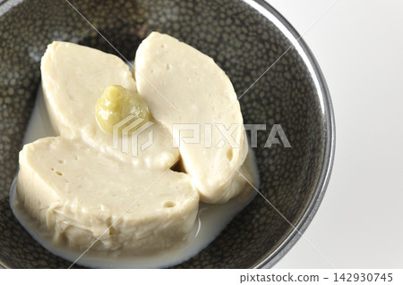 Fresh yuba (tofu skin) photographed against a white background. Fresh yuba (tofu skin) photographed against a white background. 142930745