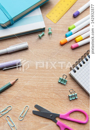 Colorful school and office supplies on wooden desk 142932877