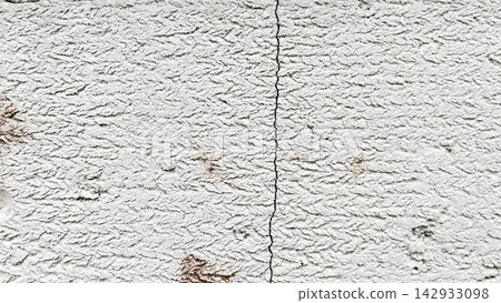 Vertical Crack on a Textured White Lightweight Concrete Block Wall Vertical Crack on a Textured White Lightweight Concrete Block Wall 142933098