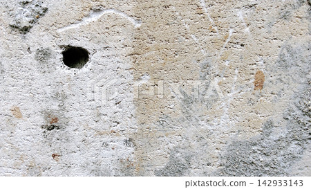 Textured Concrete Wall with a Hole and Weathered Details Textured Concrete Wall with a Hole and Weathered Details 142933143