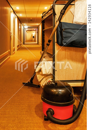 Commercial vacuum cleaners used for cleaning guest rooms in hotel corridors Commercial vacuum cleaners used for cleaning guest rooms in hotel corridors 142934116
