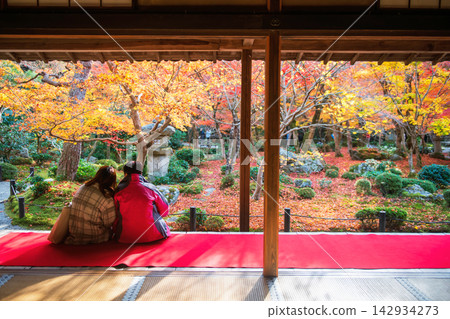 Japanese couple on Enkoji hall view colorful autumn garden, Kyoto Japanese couple on Enkoji hall view colorful autumn garden, Kyoto 142934273