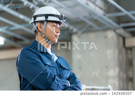 Construction workers at a construction site Construction workers at a construction site 142936507