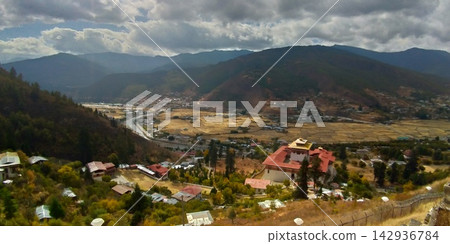 A panoramic view of Paro Dzong and Paro Valley from the Paro plateau in Bhutan. A panoramic view of Paro Dzong and Paro Valley from the Paro plateau in Bhutan. 142936784