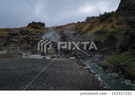 The hot spring area of Mount Kurikoma, where steam rises, and the autumn leaves. The hot spring area of Mount Kurikoma, where steam rises, and the autumn leaves. 142937282