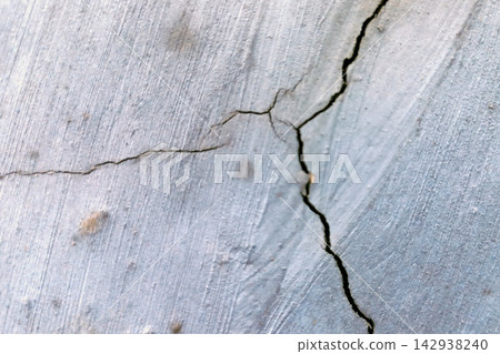 Cracks on a Weathered Concrete Wall Surface Cracks on a Weathered Concrete Wall Surface 142938240