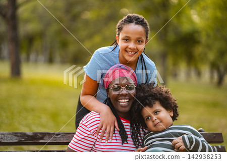 African mother and children enjoying smiling spending time outdoors African mother and children enjoying smiling spending time outdoors 142938253