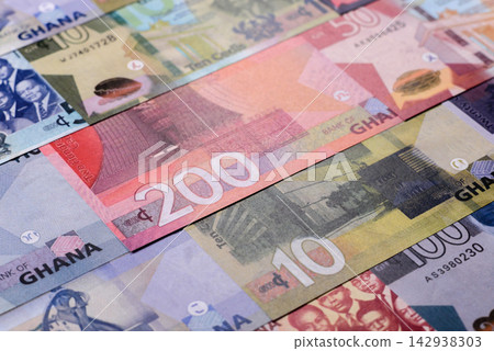 Ghana, Ghanaian paper money, cedi banknotes as currency for exchange or travel. Ghana money Ghana, Ghanaian paper money, cedi banknotes as currency for exchange or travel. Ghana money 142938303