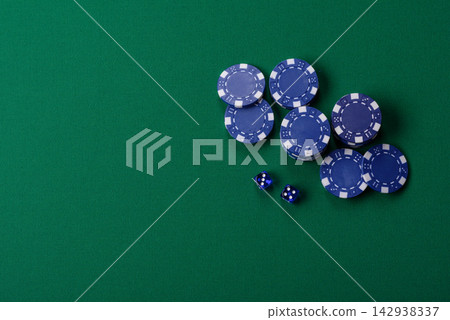 Multicolored casino chips as a conceptual backdrop for gambling games like poker, blackjack Multicolored casino chips as a conceptual backdrop for gambling games like poker, blackjack 142938337