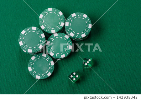 Multicolored casino chips as a conceptual backdrop for gambling games like poker, blackjack Multicolored casino chips as a conceptual backdrop for gambling games like poker, blackjack 142938342