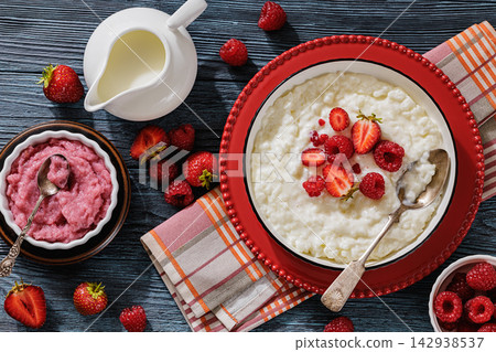 Creamy rice pudding topped with ripe berries Creamy rice pudding topped with ripe berries 142938537