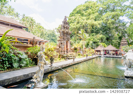 October 20, 2024, Inni Kuri Island: Scenic view of the spring water in the water pond of Shosenji Temple, full of colored carps and statues of the goddess October 20, 2024, Inni Kuri Island: Scenic view of the spring water in the water pond of Shosenji Temple, full of colored carps and statues of the goddess 142938727