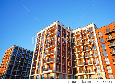 Facade of modern condominium in red and white colourful. Facade of modern condominium in red and white colourful. 142938834