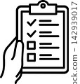 Hand holding clipboard with checked inspection list 142939017