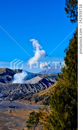 Beautiful morning view of Mount Bromo and Mount Semeru in East Java, Indonesia. Beautiful morning view of Mount Bromo and Mount Semeru in East Java, Indonesia. 142939716