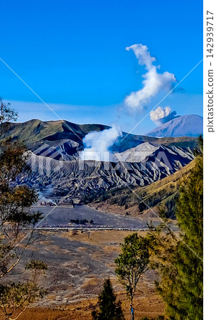 Beautiful morning view of Mount Bromo and Mount Semeru in East Java, Indonesia. Beautiful morning view of Mount Bromo and Mount Semeru in East Java, Indonesia. 142939717