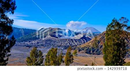 Beautiful morning view of Mount Bromo and Mount Semeru in East Java, Indonesia. Beautiful morning view of Mount Bromo and Mount Semeru in East Java, Indonesia. 142939718