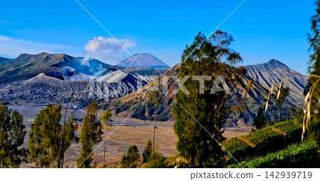 Beautiful morning view of Mount Bromo and Mount Semeru in East Java, Indonesia. Beautiful morning view of Mount Bromo and Mount Semeru in East Java, Indonesia. 142939719