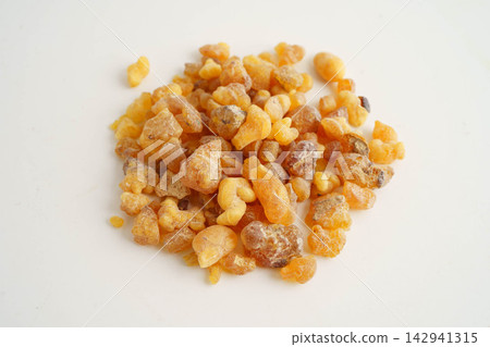 Frankincense or olibanum aromatic resin isolated on white background used in incense and perfumes. Frankincense or olibanum aromatic resin isolated on white background used in incense and perfumes. 142941315