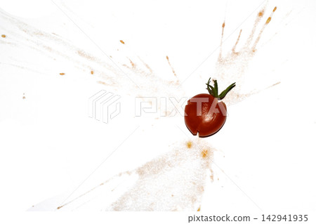 A squashed splattered and crushed broken fresh tomato with seeds A squashed splattered and crushed broken fresh tomato with seeds 142941935
