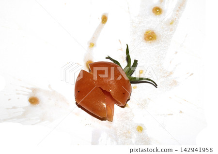 A squashed splattered and crushed broken fresh tomato with seeds A squashed splattered and crushed broken fresh tomato with seeds 142941958