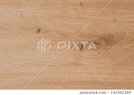 Natural oak wooden board background displaying rich grain structure and small knots for rustic carpentry projects furniture manufacturing or interior wall paneling Natural oak wooden board background displaying rich grain structure and small knots for rustic carpentry projects furniture manufacturing or interior wall paneling 142942384