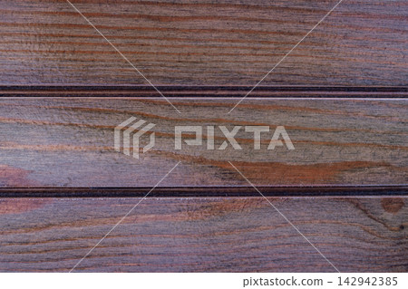 Dark stained wooden planks background with horizontal lines and glossy finish suited for luxury interior paneling rustic furniture design or architectural floor Dark stained wooden planks background with horizontal lines and glossy finish suited for luxury interior paneling rustic furniture design or architectural floor 142942385