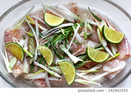 Close-up of a fish dish before cooking Close-up of a fish dish before cooking 142942505