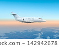 White bizjet fly in the air above the clouds 142942678