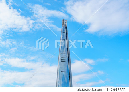 Seoul, South Korea - Sep. 18, 2026 : Lotte World Tower reaching into the clear blue sky with white clouds in Seoul, South Korea Seoul, South Korea - Sep. 18, 2026 : Lotte World Tower reaching into the clear blue sky with white clouds in Seoul, South Korea 142942851