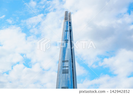 Seoul, South Korea - Sep. 18, 2026 : Lotte World Tower reaching into the clear blue sky with white clouds in Seoul, South Korea Seoul, South Korea - Sep. 18, 2026 : Lotte World Tower reaching into the clear blue sky with white clouds in Seoul, South Korea 142942852