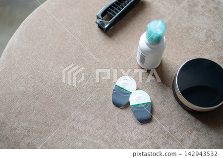 Contact lenses and cosmetics placed on a cloth. Morning routine. Contact lenses and cosmetics placed on a cloth. Morning routine. 142943532