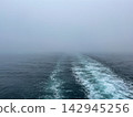 Boat Water Wake Trail on Ocean in Heavy Fog 142945256