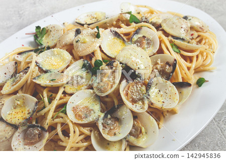 spaghetti with vongole clams, in cream sauce, carbonara, on a white plate, homemade, top view, no people, spaghetti with vongole clams, in cream sauce, carbonara, on a white plate, homemade, top view, no people, 142945836