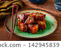 Chinese-style meat with sesame seeds and green onions, on a wooden table, homemade, no people, 142945839