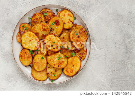 Crispy potato slices, with parmesan cheese and spices, fried in the oven, homemade, no people, Crispy potato slices, with parmesan cheese and spices, fried in the oven, homemade, no people, 142945842