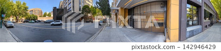 Portland, Oregon, USA - July 18, 2024: Panoramic view of a downtown street and surrounding urban architecture 142946429