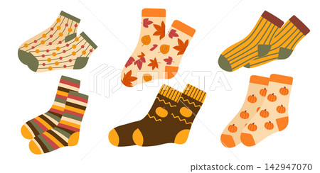 Set of cozy autumn socks with pumpkins, leaves, stripes and warm seasonal patterns. Cute flat vector illustrations isolated on white background. Set of cozy autumn socks with pumpkins, leaves, stripes and warm seasonal patterns. Cute flat vector illustrations isolated on white background. 142947070