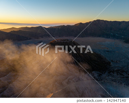 Aerial Mount Bromo Volcanic Crater Landscape at Golden Sunset Aerial Mount Bromo Volcanic Crater Landscape at Golden Sunset 142947140