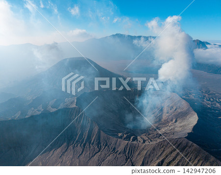 Mount Bromo rise beneath a clear blue sky Mount Bromo rise beneath a clear blue sky 142947206