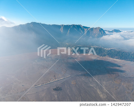 Aerial Mount Bromo Caldera and Volcanic Ash Plain in Indonesia Aerial Mount Bromo Caldera and Volcanic Ash Plain in Indonesia 142947207
